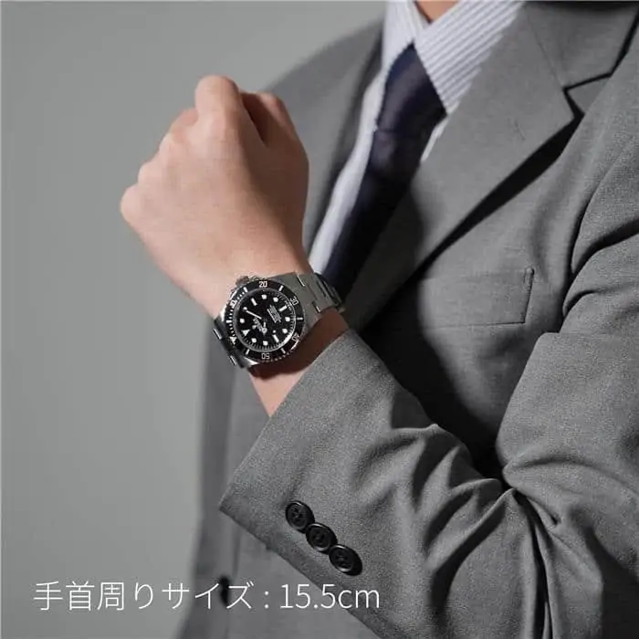 Rolex Submariner 41mm on wrist with suit showing modern sporty size